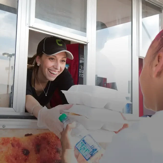 ptwmt Associates serving food out of a truck